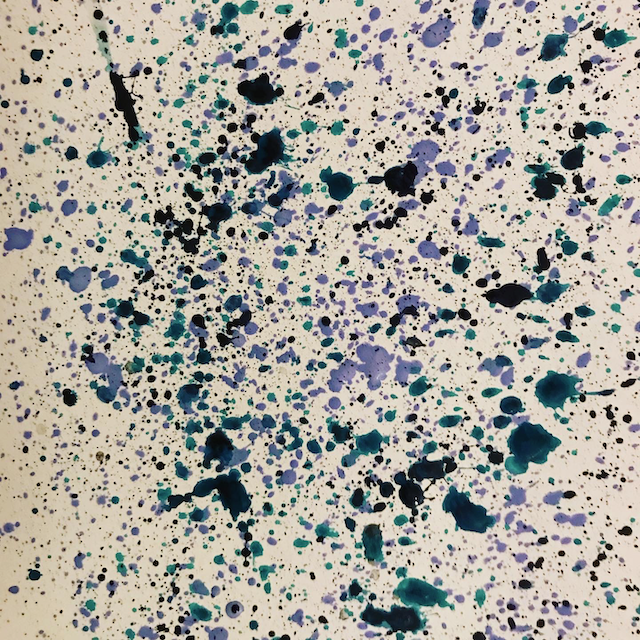 Spatters of paint in teal and purple